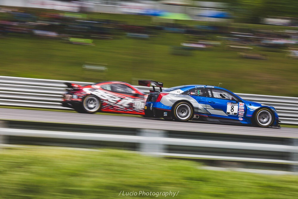 Pirelli world challenge at lime rock park. Cadillac Vs cayman down the straight!